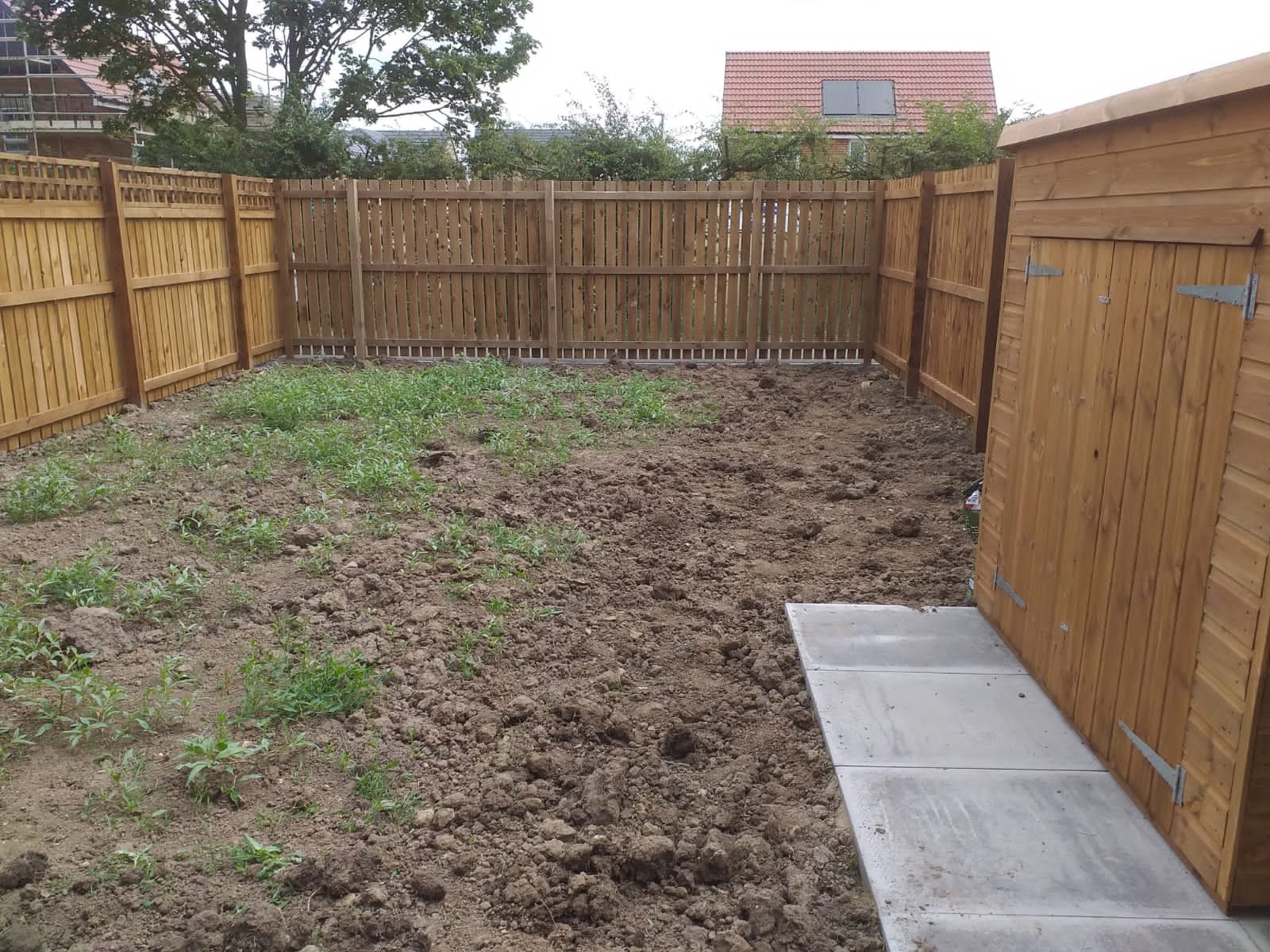 Muddy new build garden before turf laying in Walker